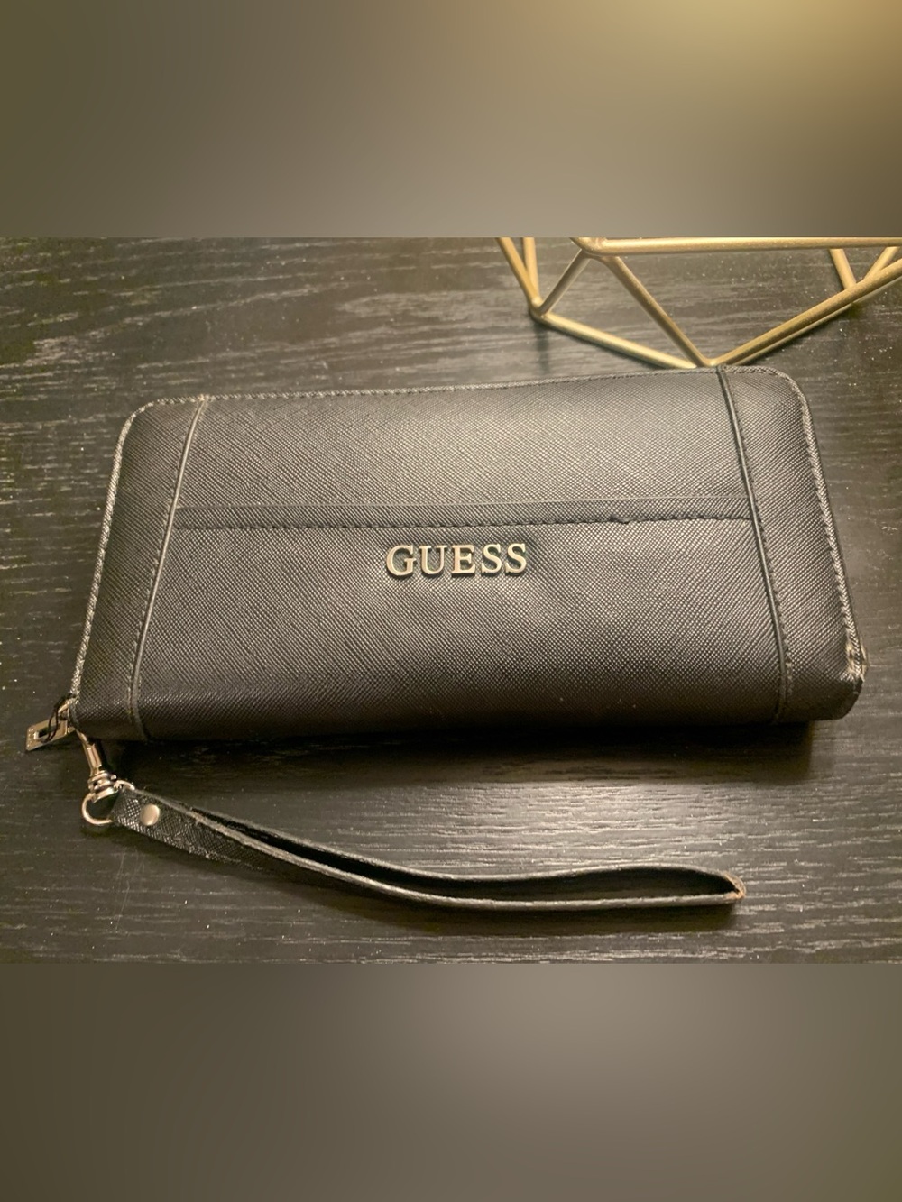 GUESS Black Stylish wristlet with textured finish.